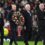 Erik Ten Hag walks out onto the pitch with a bagpipe player